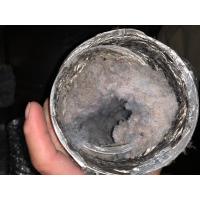 Clogged lint inside of a dryer vent prior to cleaning. 
